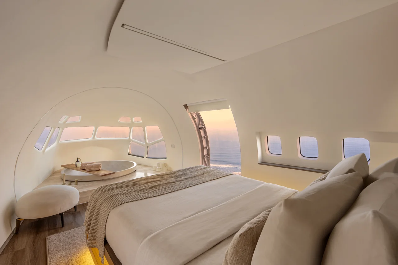 A suite inside the fuselage, ocean beyond the windows