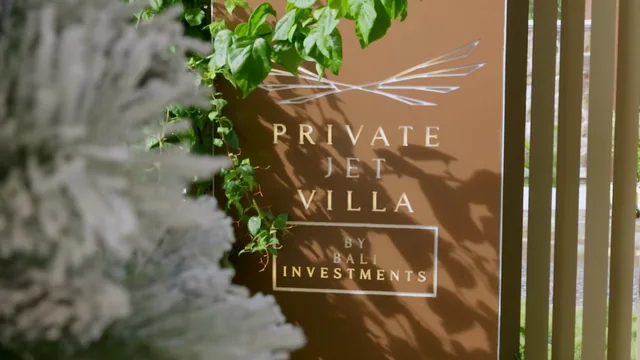 The villa signage in the greenery