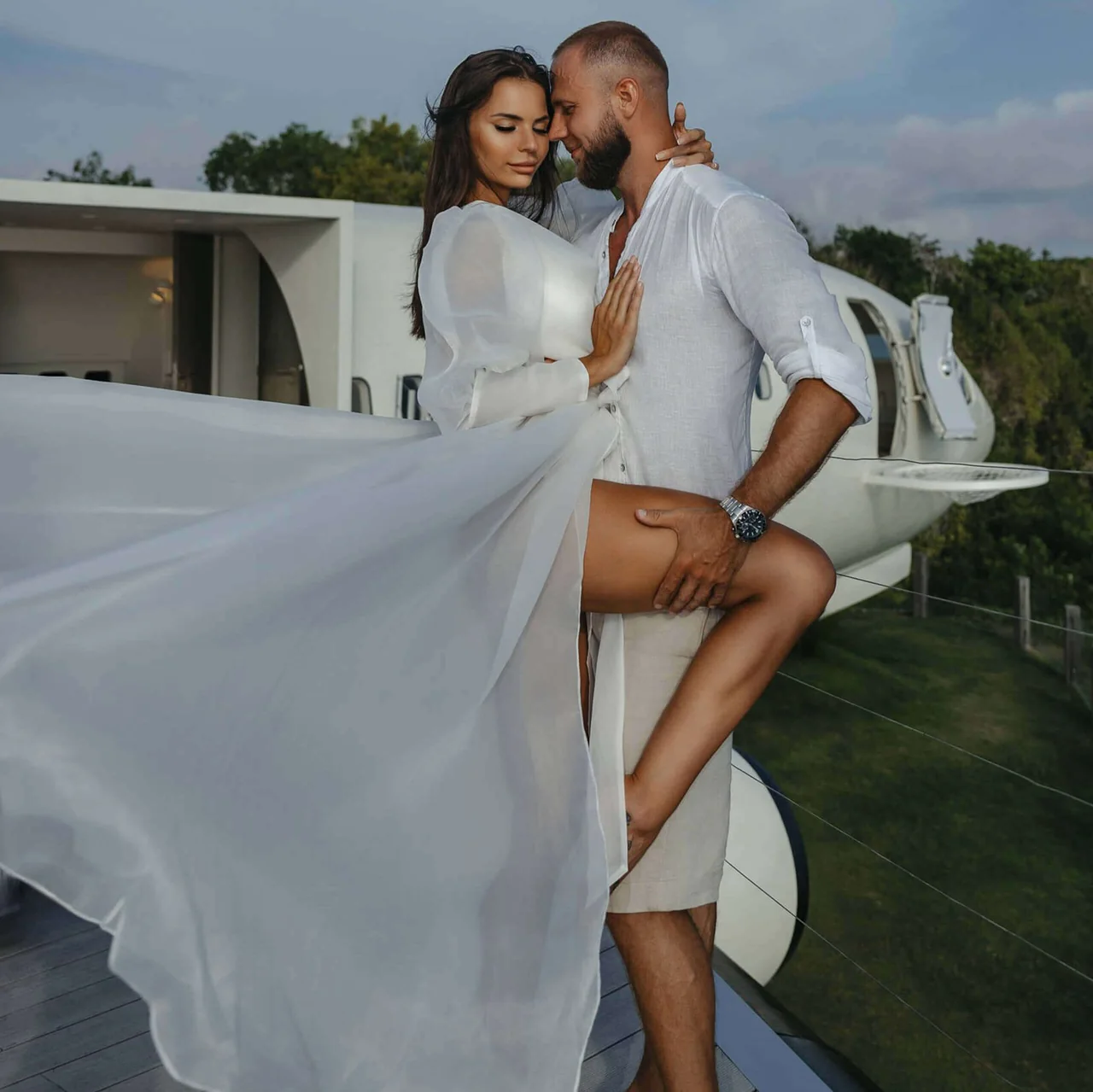 A couple photographed beside the aircraft
