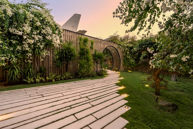 The garden path lit at dusk