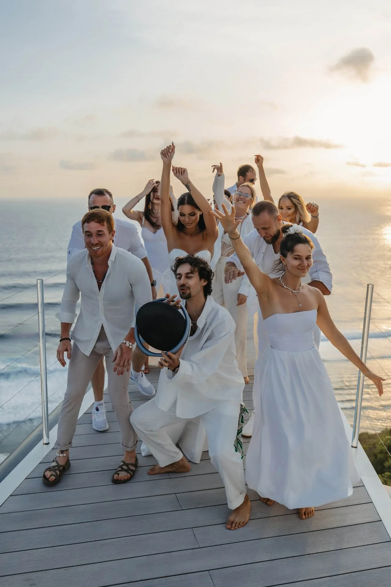A group celebrating at sunset