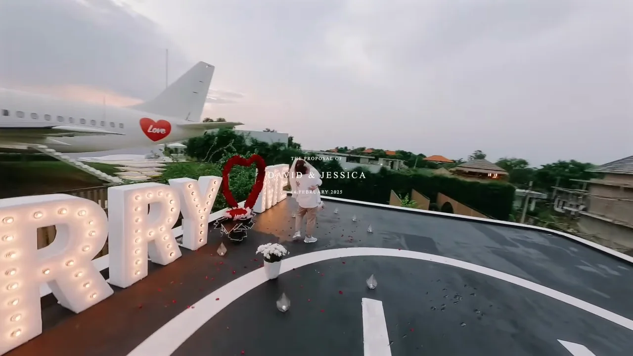 MARRY ME letters and a rose heart on the helipad