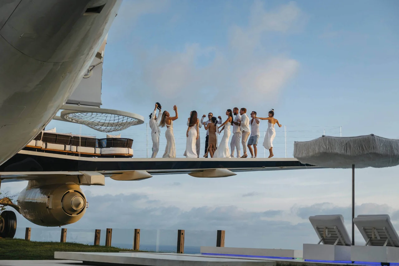 Guests dancing on the wing as the sun sets